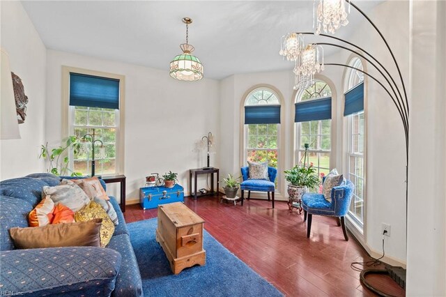 2234 Creekway Dr, Smithfield, VA 23430 - living area featuring wood finished floors, a chandelier, and baseboards