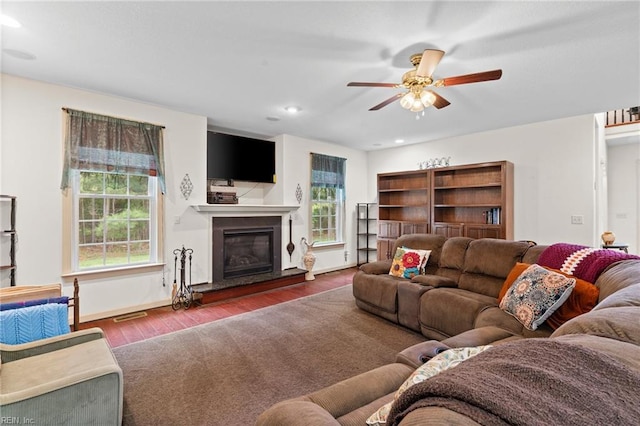 2234 Creekway Dr, Smithfield, VA 23430 - living area featuring wood finished floors, a ceiling fan, a glass covered fireplace, recessed lighting, and baseboards