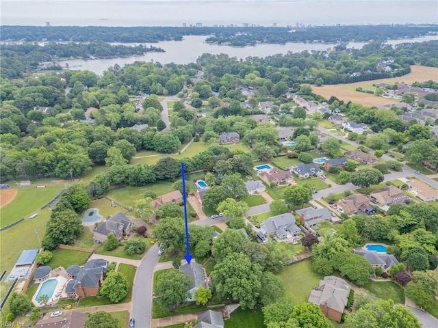 aerial view of residential area with a large body of water