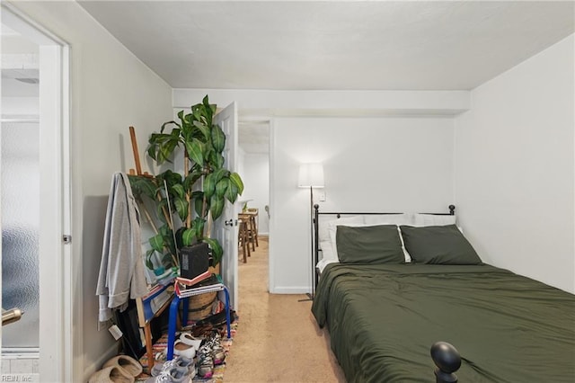 bedroom with light carpet