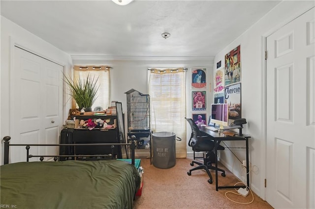 carpeted bedroom featuring baseboards