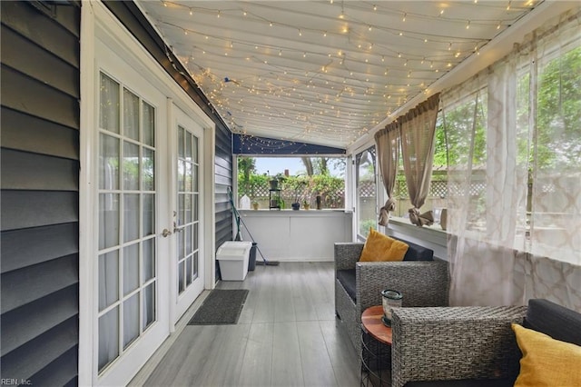 sunroom with french doors and vaulted ceiling
