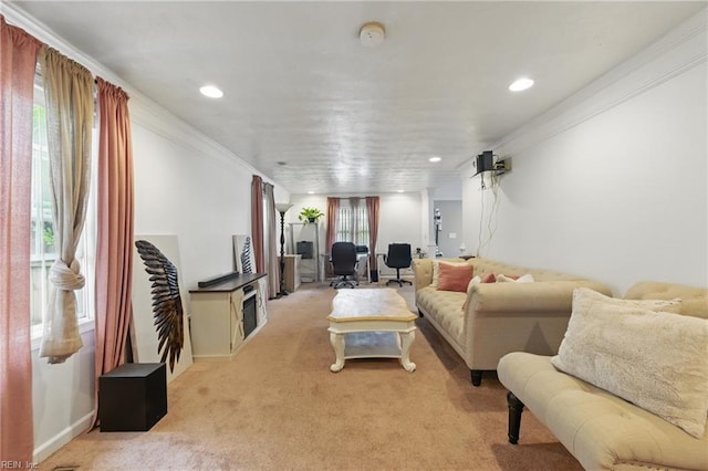 living area with light colored carpet, recessed lighting, crown molding, and baseboards