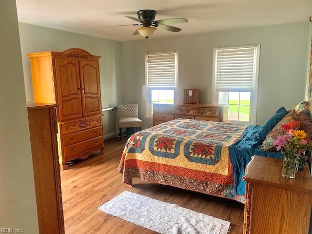 949 Kings Fork Rd, Suffolk, VA 23434 - bedroom with light wood-type flooring, multiple windows, and ceiling fan