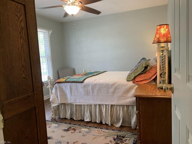 949 Kings Fork Rd, Suffolk, VA 23434 - bedroom with wood finished floors, ceiling fan, and baseboards