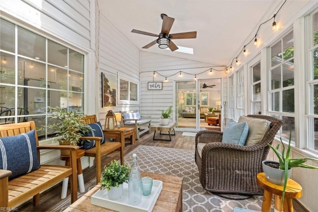 sunroom with a ceiling fan, lofted ceiling, outdoor lounge area, french doors, and rail lighting