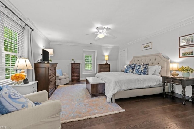 bedroom featuring dark wood-type flooring, crown molding, and a ceiling fan