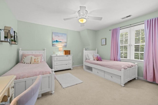 bedroom with light carpet and ceiling fan