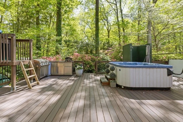 wooden terrace featuring a hot tub and area for grilling
