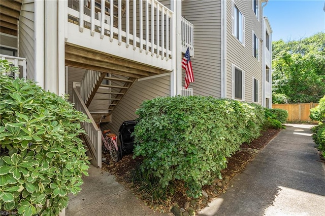 view of home's exterior featuring fence
