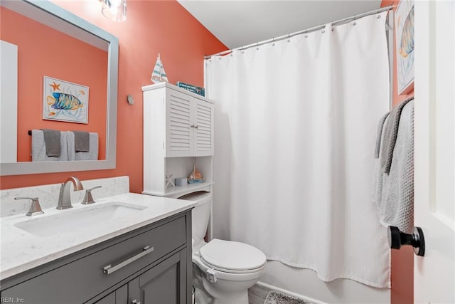 full bath featuring toilet and vanity