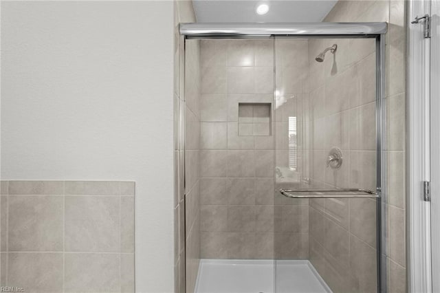 full bathroom featuring a shower stall