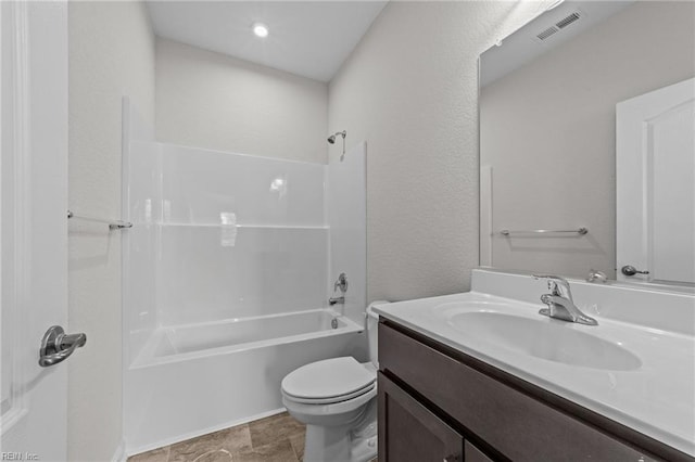 bathroom featuring toilet, bathtub / shower combination, and vanity