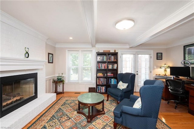338 W Olney Rd, Norfolk, VA 23507 - living area with beam ceiling, wood finished floors, ornamental molding, a desk, and a fireplace