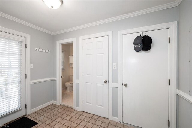 338 W Olney Rd, Norfolk, VA 23507 - doorway to outside featuring crown molding, light tile patterned flooring, and baseboards