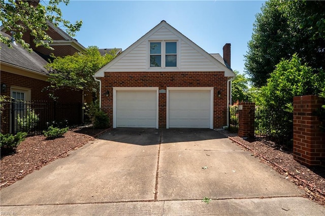 338 W Olney Rd, Norfolk, VA 23507 - view of front of property featuring brick siding, a garage, a chimney, and fence