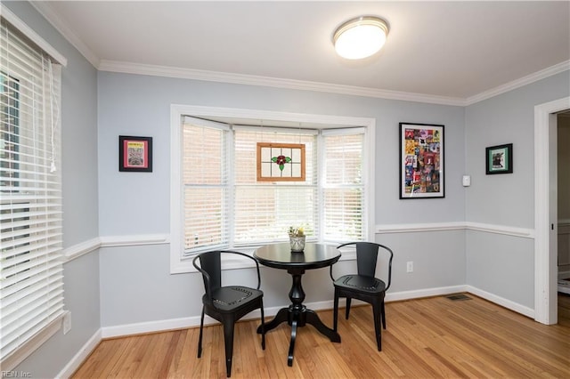 338 W Olney Rd, Norfolk, VA 23507 - dining area with light wood-type flooring, crown molding, and baseboards