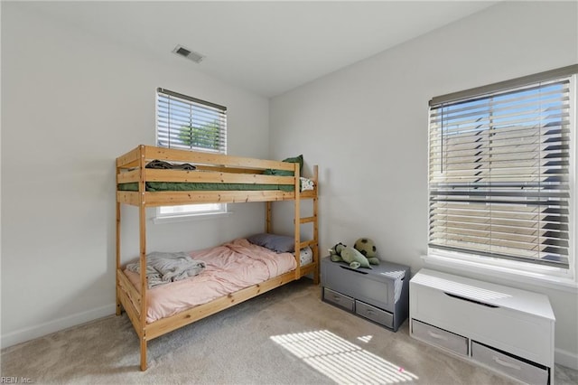 carpeted bedroom with baseboards