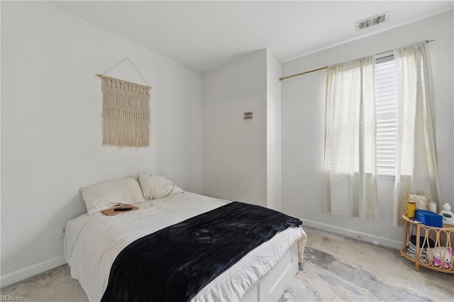 bedroom featuring carpet floors and baseboards