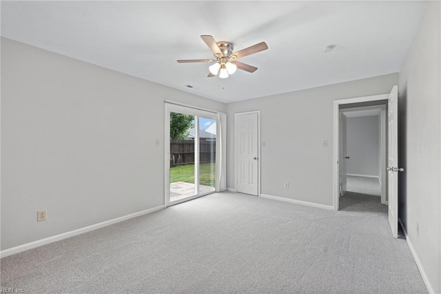 unfurnished bedroom with access to exterior, light carpet, baseboards, and a ceiling fan