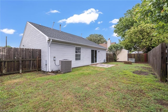back of property with central air condition unit and a patio