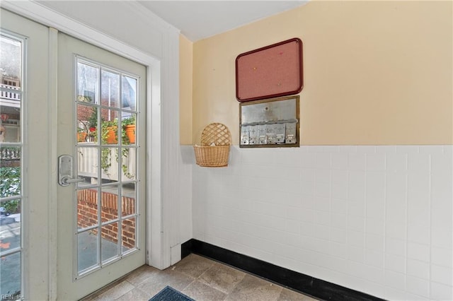 entryway featuring wainscoting