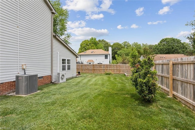 view of yard featuring central AC and a cooling unit
