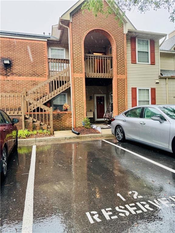 813 Gaslight Ln Unit 813, Virginia Beach, VA 23462 - view of property with uncovered parking and stairs