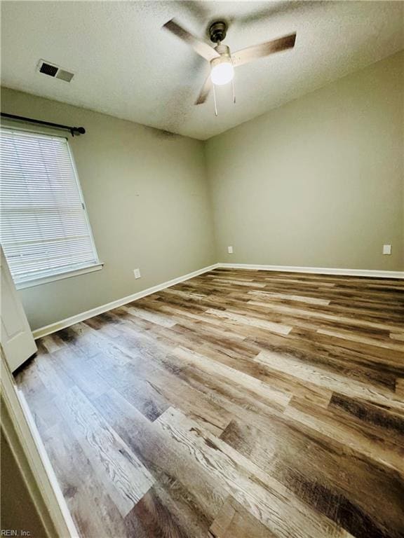 813 Gaslight Ln Unit 813, Virginia Beach, VA 23462 - spare room featuring wood finished floors, a ceiling fan, baseboards, and a textured ceiling