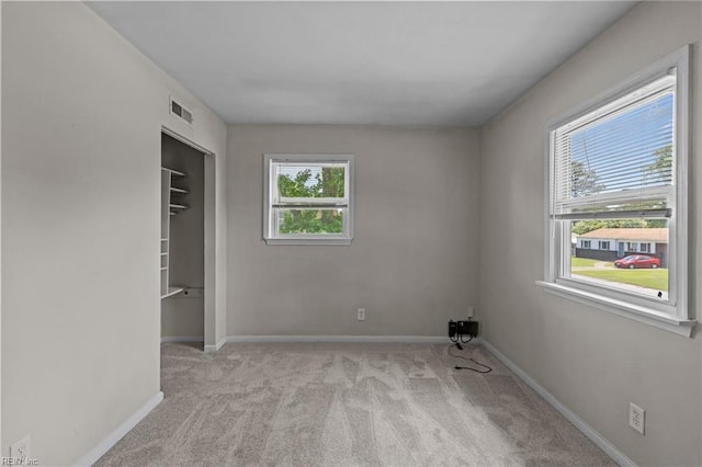 unfurnished bedroom with carpet and baseboards