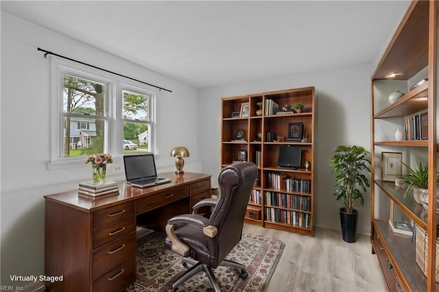 office area with light wood-style floors