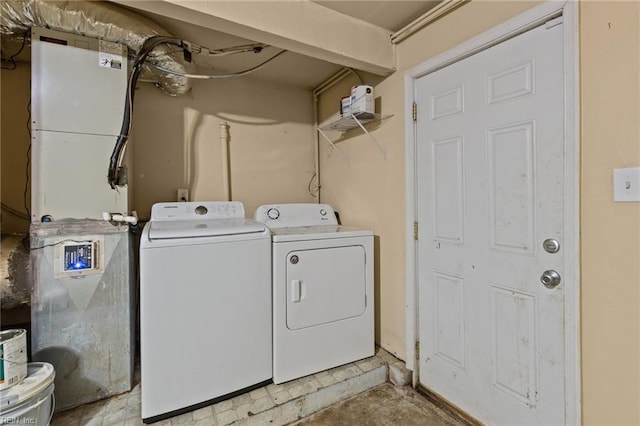 washroom with washer and dryer