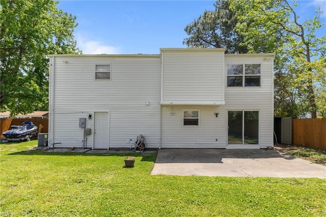 rear view of property with a patio area and central AC