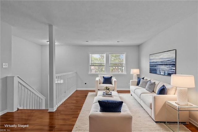 living room with wood finished floors and baseboards