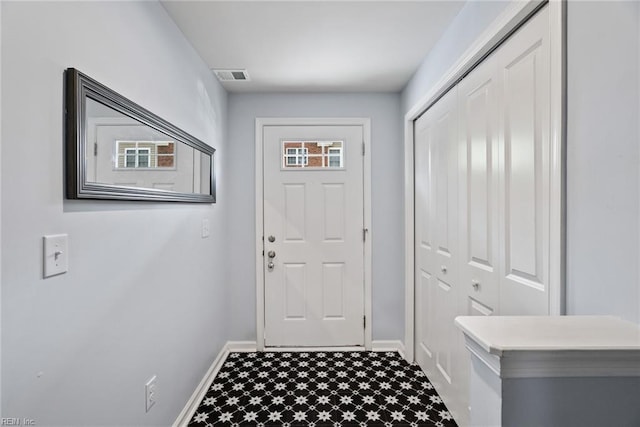 703 Lakeview Cv, Smithfield, VA 23430 - doorway to outside featuring dark floors and baseboards