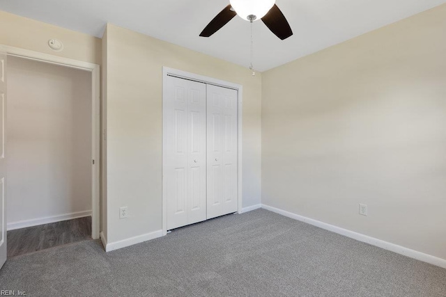 unfurnished bedroom featuring carpet, baseboards, a closet, and ceiling fan