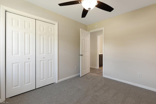 unfurnished bedroom with carpet floors, baseboards, a closet, and ceiling fan