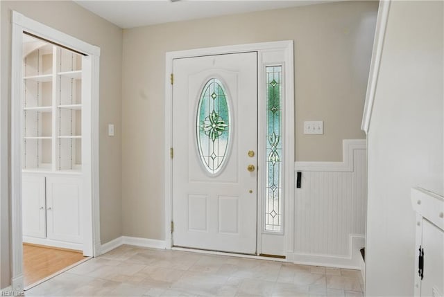 entryway featuring wainscoting
