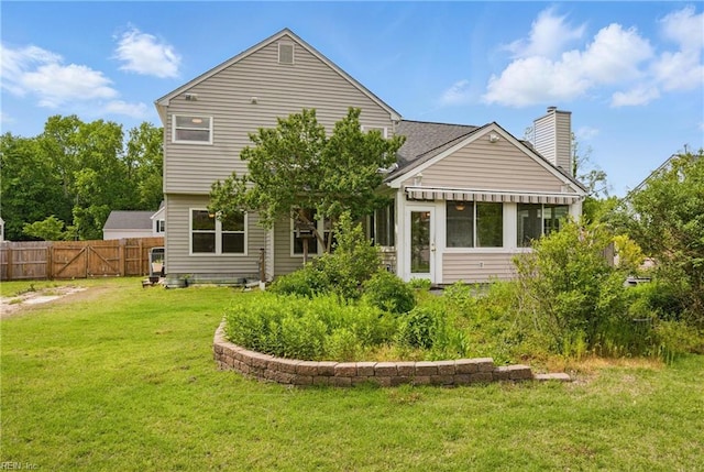 back of property featuring a chimney