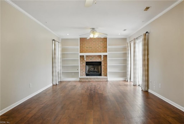 unfurnished living room featuring a ceiling fan, hardwood / wood-style flooring, baseboards, a brick fireplace, and ornamental molding