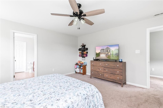 carpeted bedroom featuring baseboards and a ceiling fan