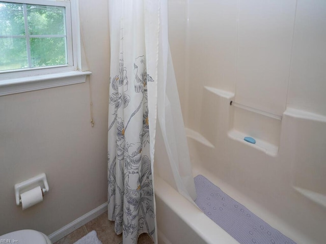 full bathroom featuring baseboards