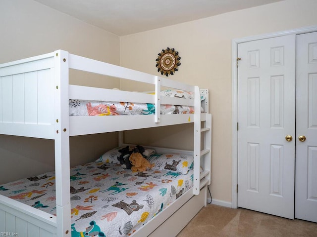 carpeted bedroom with baseboards