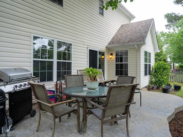 view of patio / terrace featuring outdoor dining space and fence