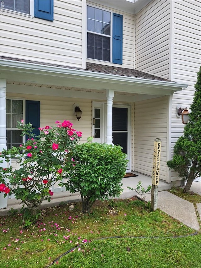 doorway to property featuring a porch
