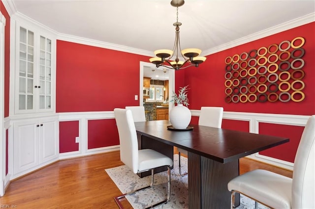 1276 Hebden Cv, Virginia Beach, VA 23452 - dining area featuring a chandelier, crown molding, and light wood finished floors