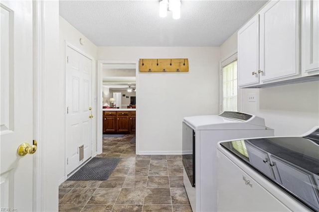 washroom with cabinet space, independent washer and dryer, a textured ceiling, baseboards, and ceiling fan