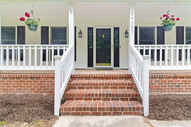 entrance to property with covered porch