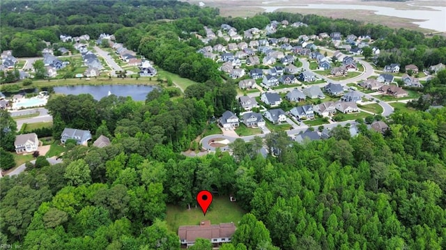 aerial view of property and surrounding area with a large body of water