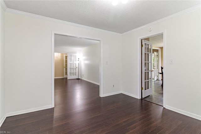 unfurnished room with wood finished floors, a textured ceiling, baseboards, and ornamental molding